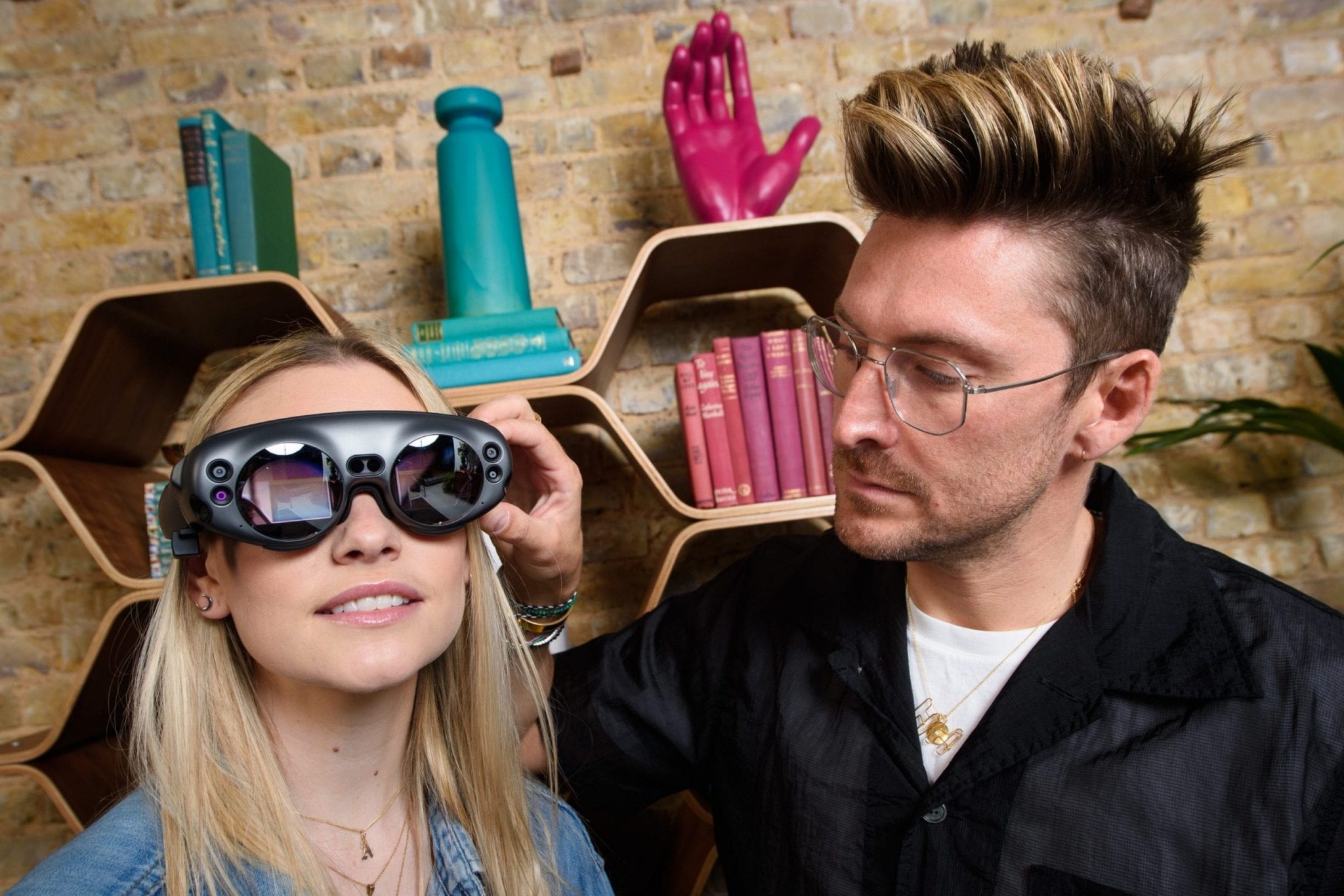 Designer Henry Holland, with staff member Ali Flowers, unveils the ‘Living Room of the Future’ as Three launches 5G home broadband at its flagship store on Oxford Street, London. The 5G fuelled AR experience will include; an AI Powered Voice Assistant, a Virtual Mindfulness Session, a Game Stream and shopping deliveries via drone. Photo credit: Matt Crossick/PA Wire